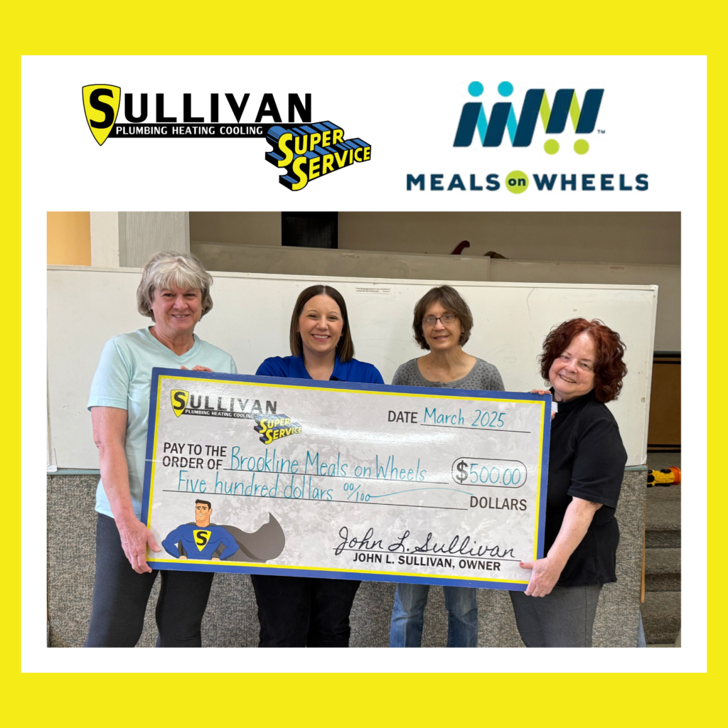 Four women hold a large $500 check from Sullivan Plumbing Heating Cooling to Brookline Meals on Wheels, dated March 2025, in front of a whiteboard with company logos above.